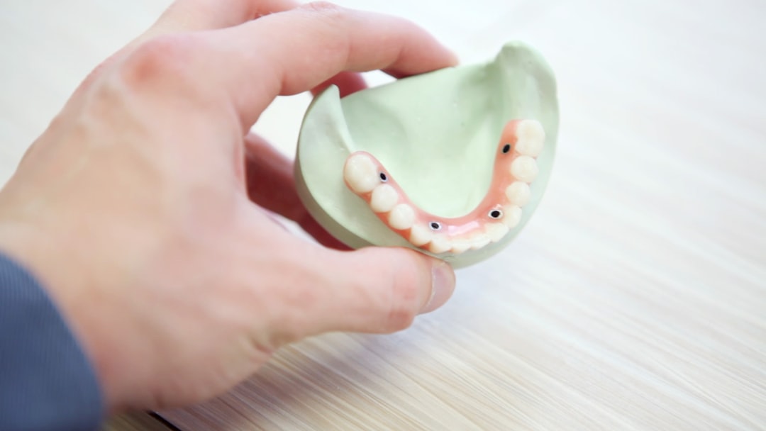 dental hygienist using ultrasonic scaler during dental cleaning - dental cleaning check up